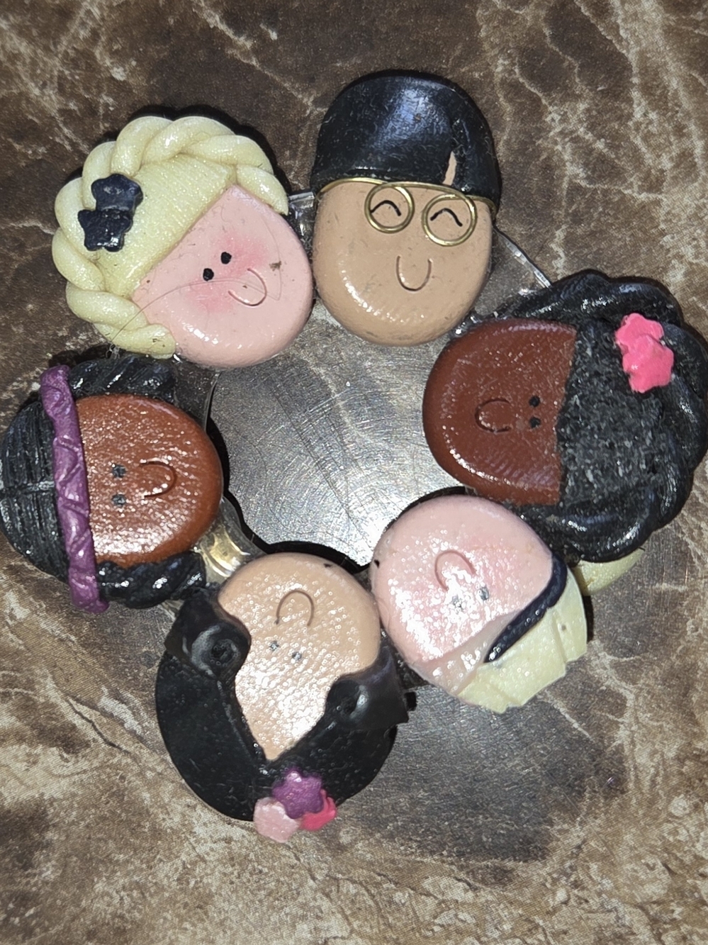 Vintage cultural brooch 
Brooch Pin Signed Kansas Cousins 1994 Children Faces